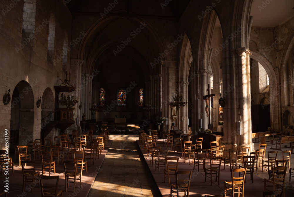Notre Dame Church interior. Chairs arranged to keep social distance due to Covid-19 pandemic. Health measures for struggle Coronavirus epidemic propagation.  Chateau-Landon, France