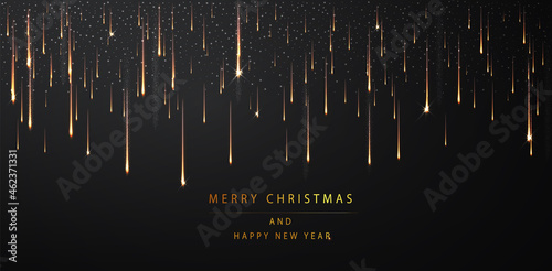 Merry Christmas and Happy new year background. Shimmering golden particles on a dark background. Abstract holiday background.