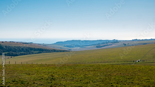 The South Downs, East Sussex, England. The rolling countryside on the English south coast looking out towards the distant English Channel coastline.