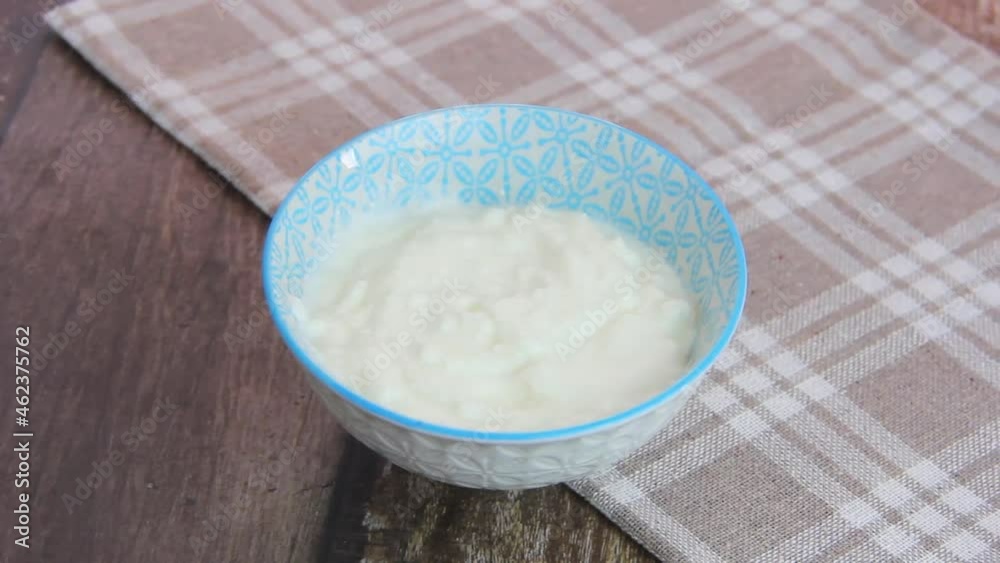 white fermented milk yogurt in a glass bowl white fermented milk yogurt in a glass bowl