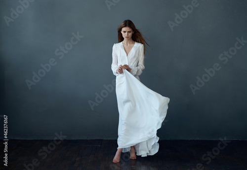 woman white dress fashion elegant style studio dark background posing