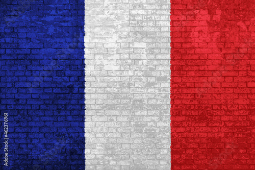 Fototapeta Naklejka Na Ścianę i Meble -  wall of bricks painted with the national flag of France. Blue, white red 3D background. Concept of social barriers of immigration, divisions, and political conflicts in France. 3D illustration