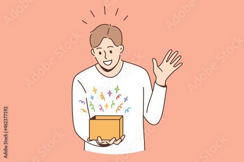 Feeling surprised and amazed concept. Young smiling boy man cartoon character standing looking at box with colorful surprise feeling amazed vector illustration 