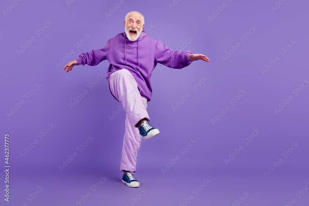 Full length body size view of attractive cool cheerful man moving fooling having fun isolated over bright violet purple color background