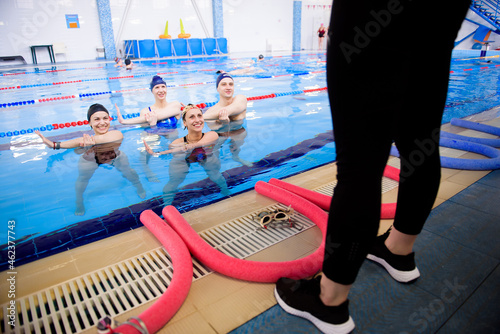 Fototapeta Naklejka Na Ścianę i Meble -  Aqua aerobics training in the water sports center.