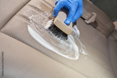 Manual cleaning car interior with help of brushing