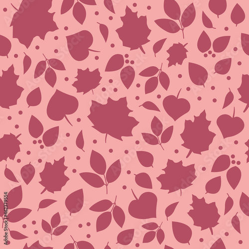 Ditsy autumn leaves seamless vector pattern texture, with a blush pink background. Girly, cute, feminine fall season design with leaf silhouette illustrations.
