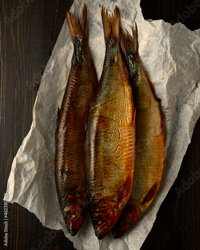 Overhead view of smoked ocean fish on rustic background