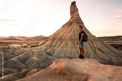 Young adult at famous Castildetierra natural monument at Bardenas Reales desert, Navarra, Basque Country.