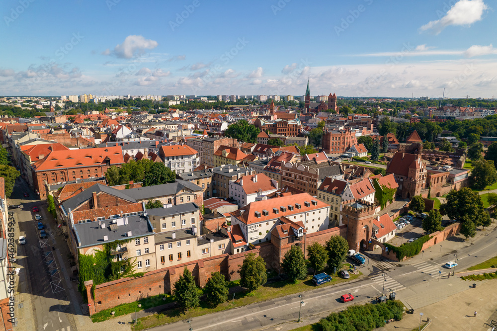 Torun, a Polish city during the day. A sunny and slightly cloudy day in Toruń on the Vistula River.