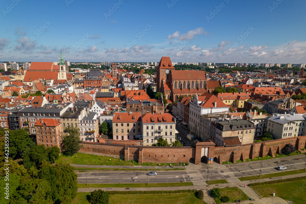Torun, a Polish city during the day. A sunny and slightly cloudy day in Toruń on the Vistula River.