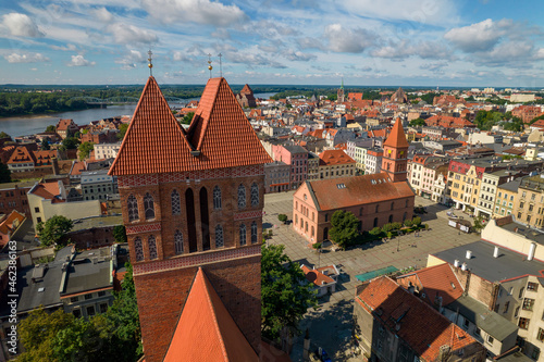 Torun, a Polish city during the day. A sunny and slightly cloudy day in Toruń on the Vistula River.