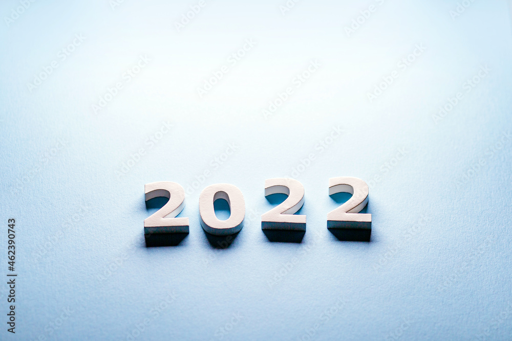 Obraz premium Digits 2022. White digits. numbers 2022. White digits. numbers 2022.Merry Christmas theme.Happy new year 2022.Minimal Christmas card on a blue background with a gift.Merry Christmas 
