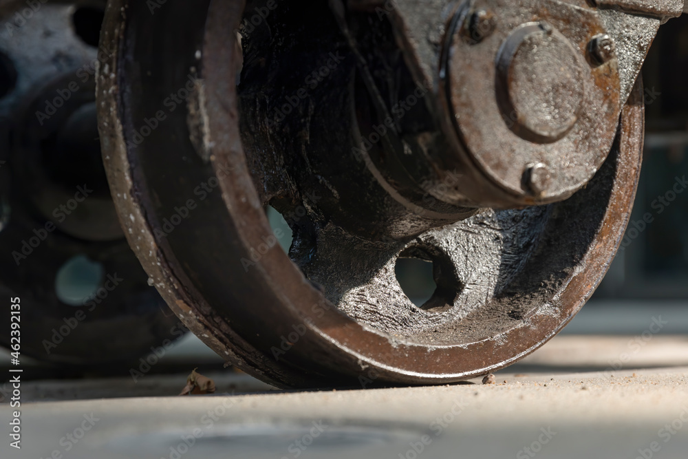 Old rusty factory wagon wheels from steam revolution times Old rusty factory wagon wheels from steam revolution times