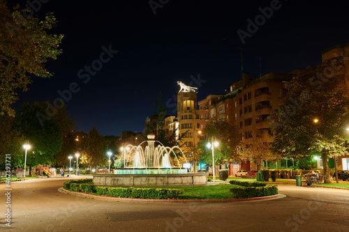 Fountain in the park of Botica Vieja with the tiger sculpture at the background at night