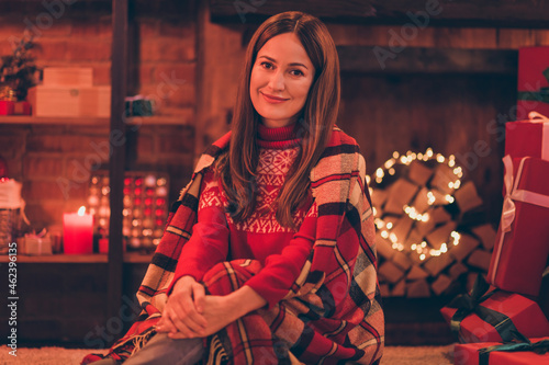 Photo of cheerful adorable mature lady wear red pullover smiling having rest enjoying christmas indoors house home room
