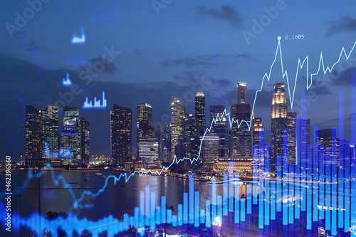 FOREX graph hologram  aerial night panoramic cityscape of Singapore  the developed location for stock market researchers in Asia. The concept of fundamental analysis. Double exposure.