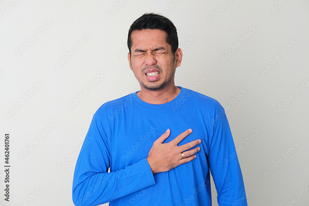 Adult Asian man suffering chest pain