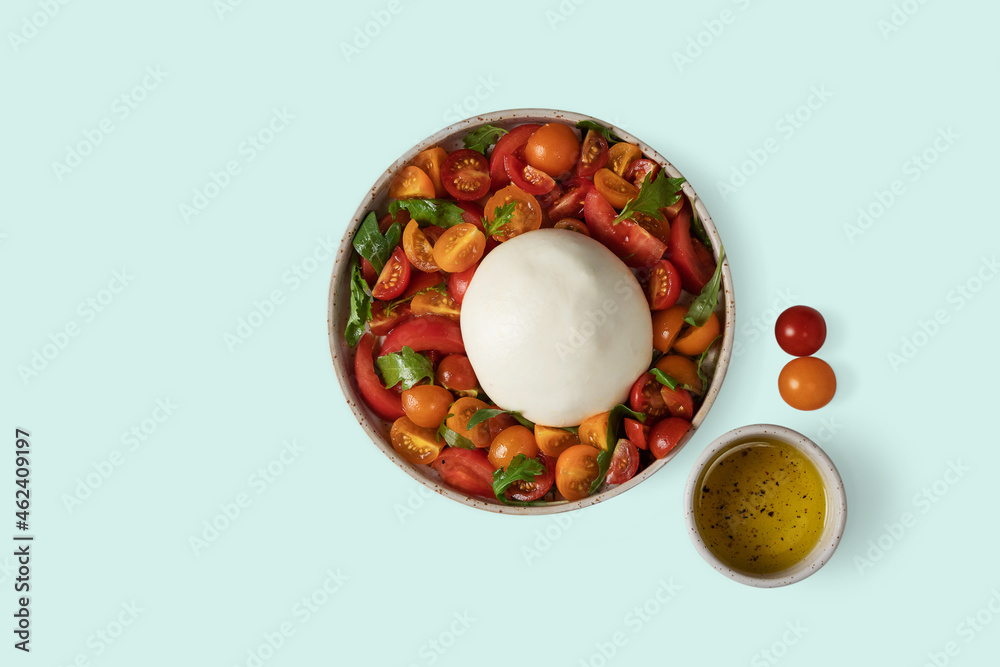 Burrata salad with tomatoes, arugula, chard, mizuna lettuce. Italian Cuisine Burrata salad with tomatoes, arugula, chard, mizuna lettuce. Italian Cuisine