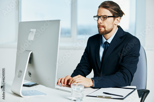 male manager at the desk with glasses work executive