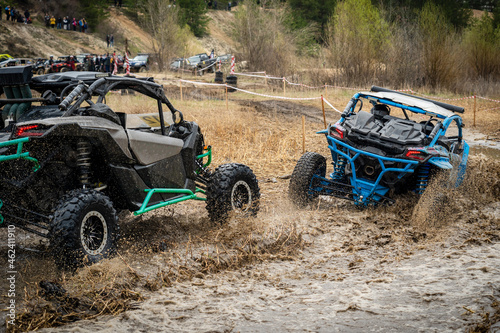 Atv vehicles in muddy water at the quad (buggy) competition © Anton Tolmachov