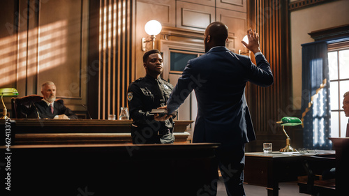 Law and Justice Court Case Witness Solemnly Swears that the Evidence He Shall Give Shall be the Truth and Nothing but the Truth Before Testifying to Lawyers and Judge in Courthouse.