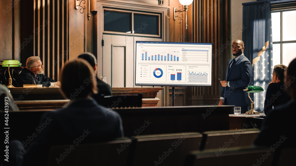 Court of Law Trial in Session: Portrait of Charismatic Male Public Defender Showing Analysis of Financal Crime on TV Screen to Judge and Jury. Attorney Lawyer Protecting Client, Presenting Case. - obrazy, fototapety, plakaty 