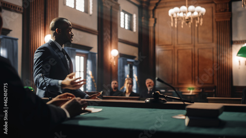Photography Court of Justice and Law Trial: Male Public Defender Presenting Case, Making Passionate Speech to Judge, Jury