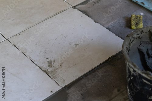 Close-up Installing tiles floor in construction work © Angelov