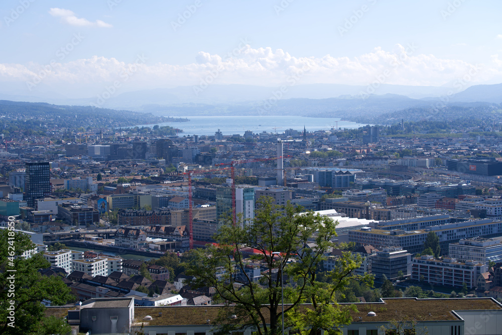 Panorama view over the City of Zurich with lake Zurich and Swiss alps in the background at a beautiful late summer day. Photo taken September 18th, 2021, Zurich, Switzerland.