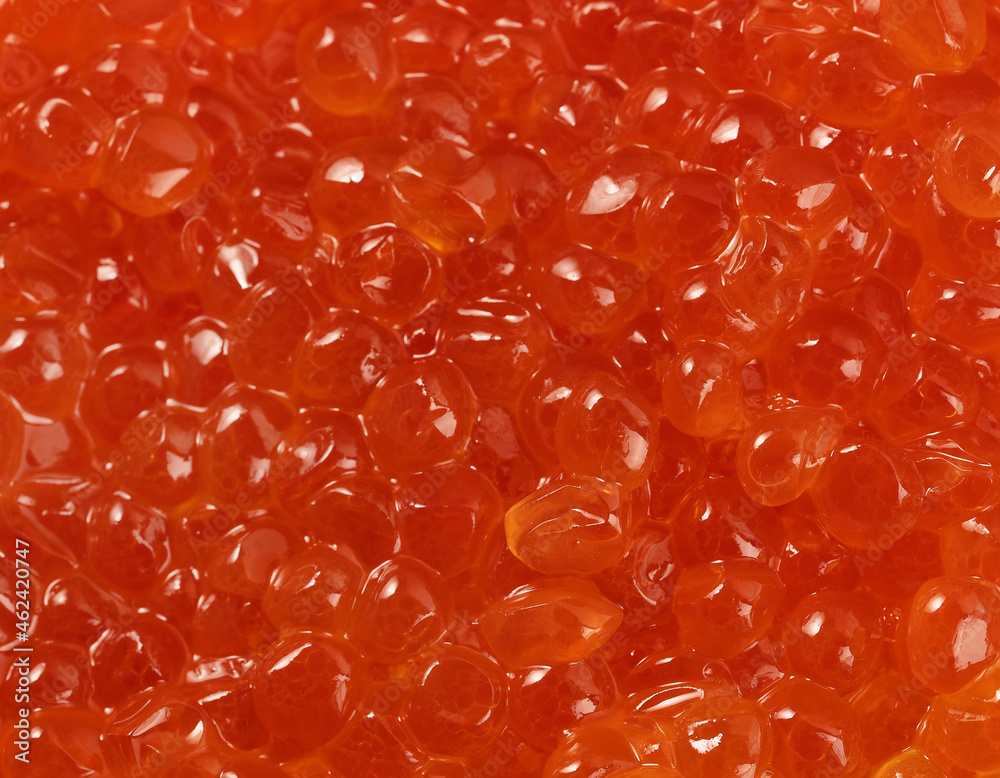 Orange or red luxury caviar as background texture pattern. Healthy sea food Orange or red luxury caviar as background texture pattern. Healthy sea food
