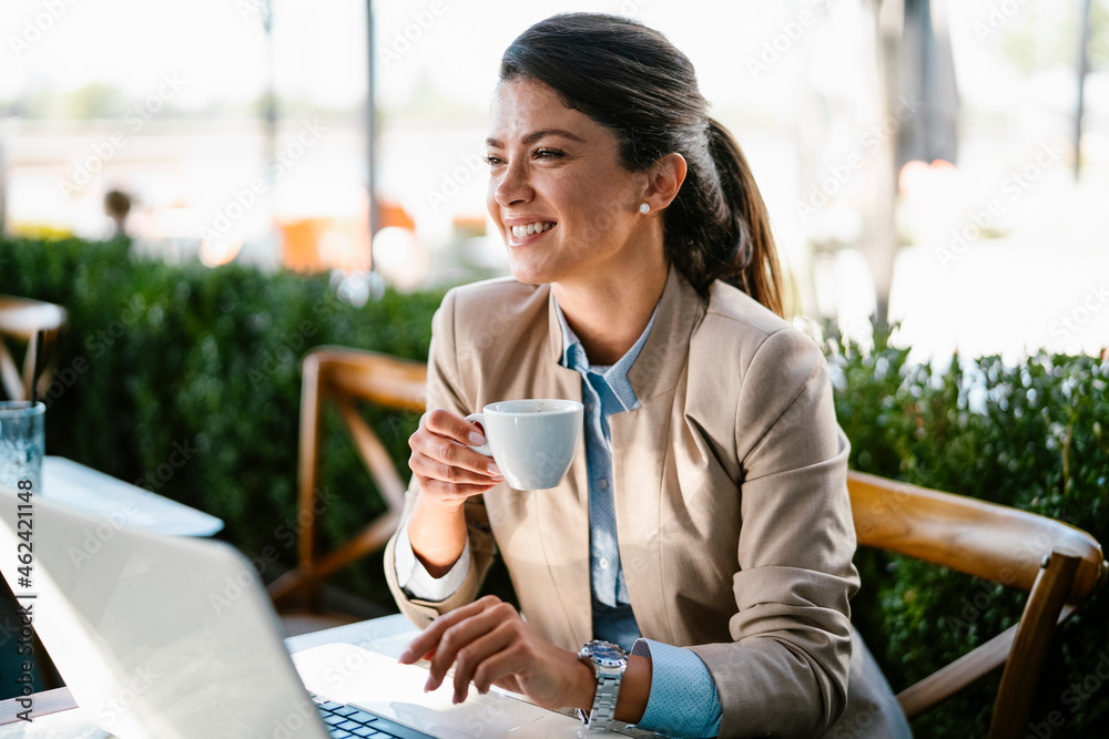 Businesswoman working in cafe. Beautiful woman with lap top having video call. Businesswoman working in cafe. Beautiful woman with lap top having video call.