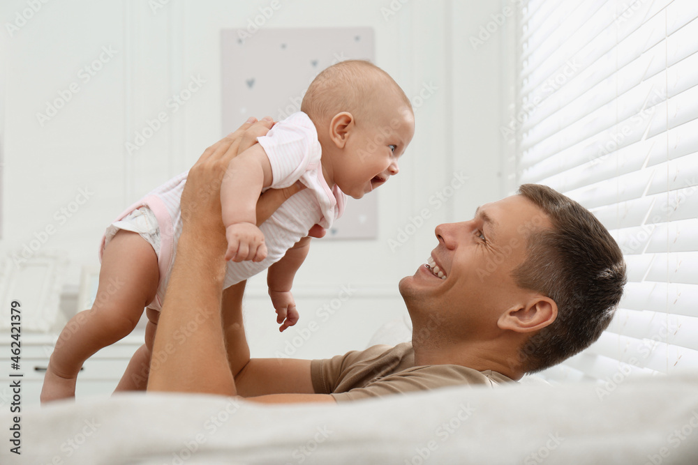 Happy father with his little baby at home Happy father with his little baby at home