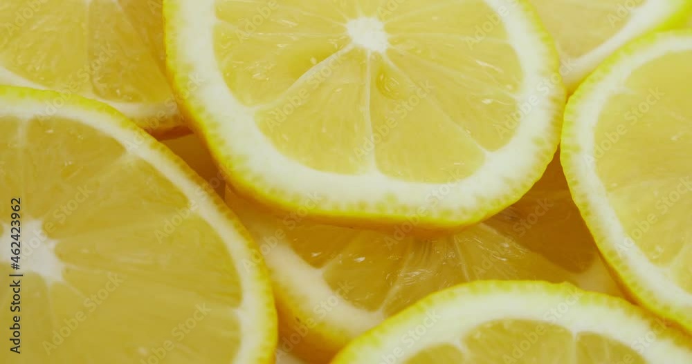 Rotation of yellow lemon slices, 360 degree rotation, close-up of a lemon in a cut.