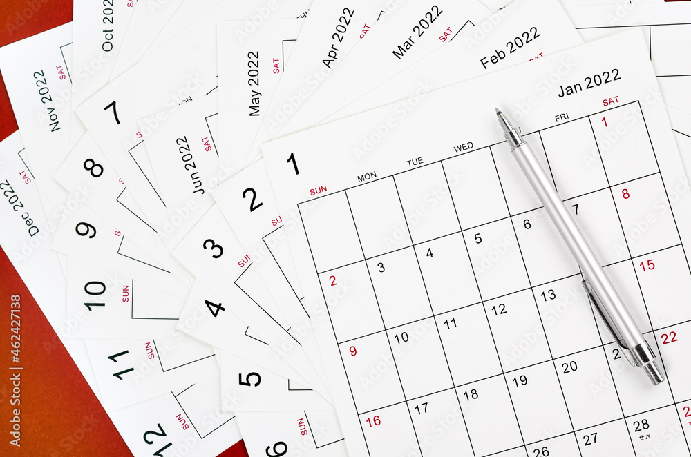 Many blank monthly 2022 calendar sheet with pen Many blank monthly 2022 calendar sheet with pen