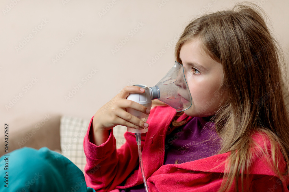Cute child patient inhalation therapy by the mask of inhaler Cute child patient inhalation therapy by the mask of inhaler