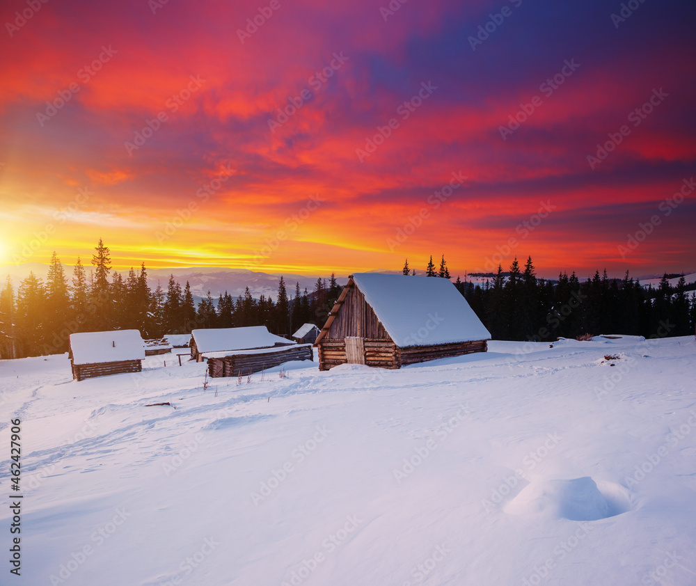 Snow-capped mountain huts in the frosty evening. Snow-capped mountain huts in the frosty evening.