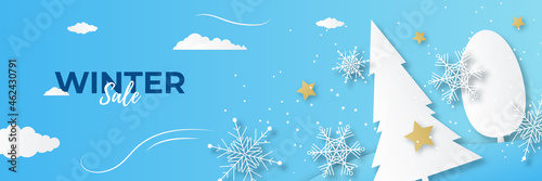 Blue shiny winter christmas sale banner with snow, palm tree, snowflake, and mountain.