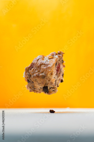 Stock photo panettone with candied fruit in plain background