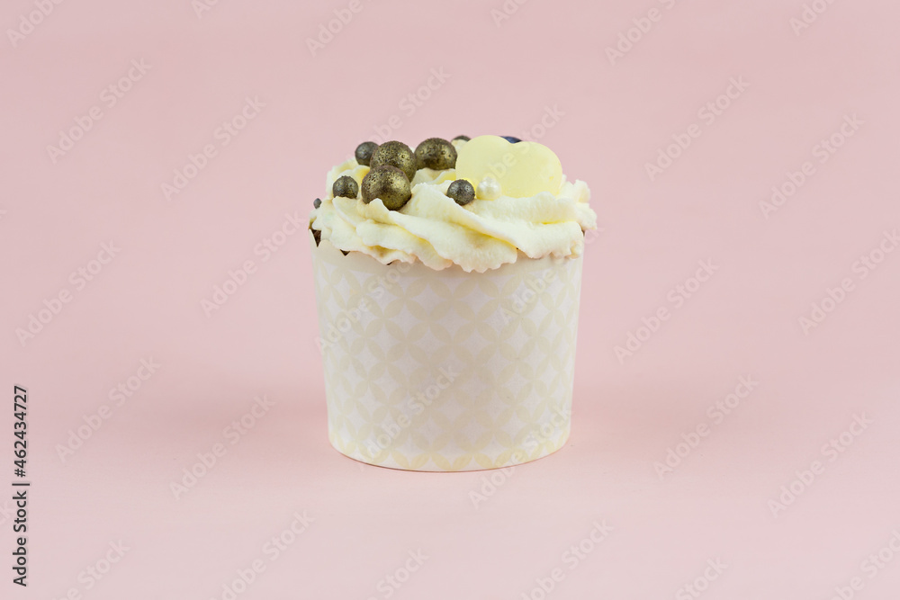 Beautiful cupcake with a decoration from berries on a pink background Beautiful cupcake with a decoration from berries on a pink background
