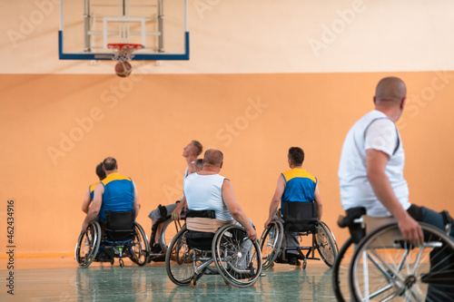a photo of basketball teams with disabilities with the selector in the big hall before the start of the basketball game