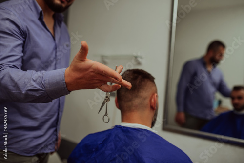 Young Man in Barbershop Hair Care Service Concept. Selective focus
