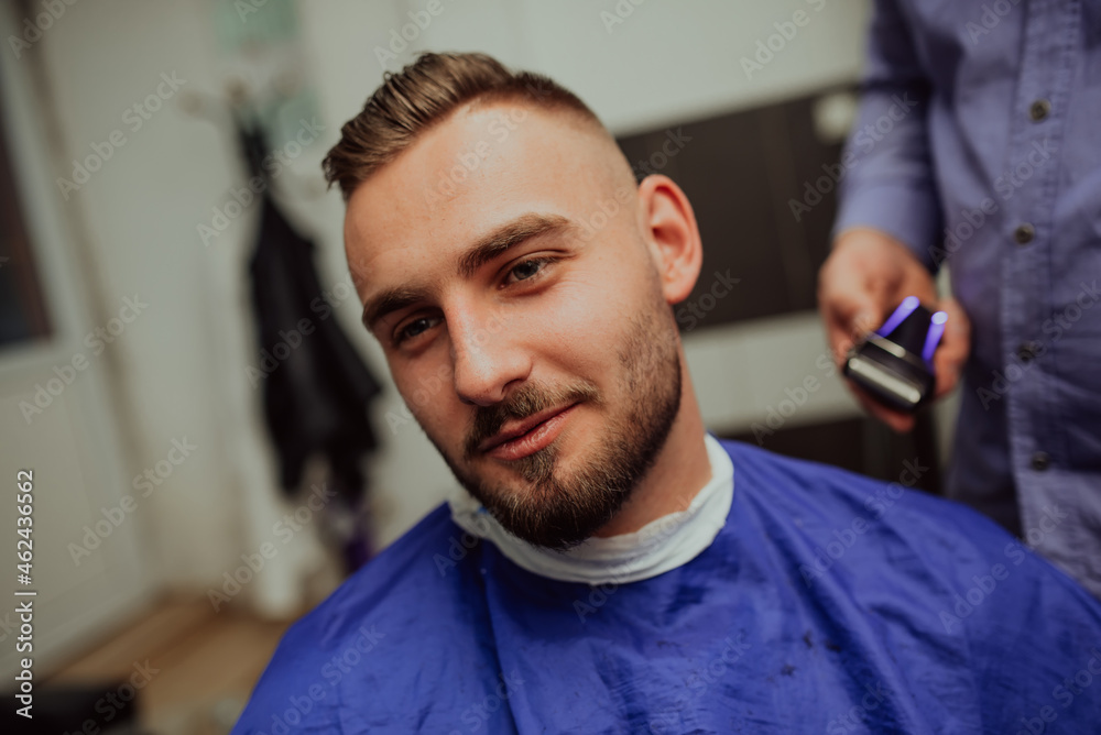 Young Man in Barbershop Hair Care Service Concept. Selective focus Young Man in Barbershop Hair Care Service Concept. Selective focus