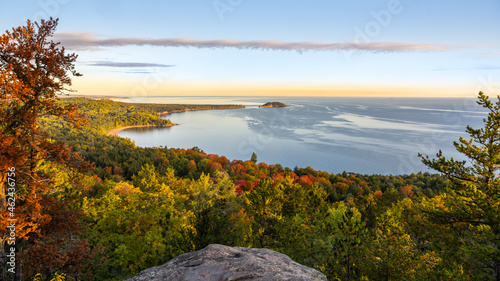 Autumn-colored dawn breaks over the Little Presque Isle and Lake Superior, viewed from Sugarloaf Mtn, Marquette, Michigan. photo