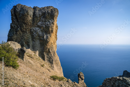 Rock called Devil's finger in the Karadag nature reserve against the blue sky. Black sea. Crimea