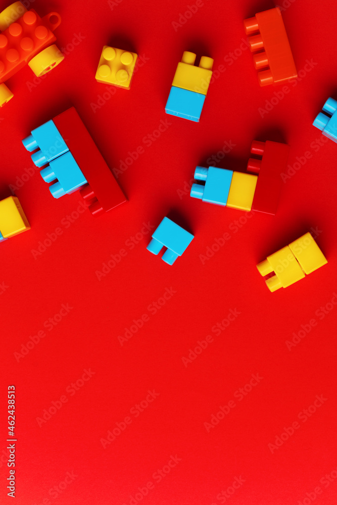 colorful toy blocks, on red background.
colorful toy blocks, on red background.