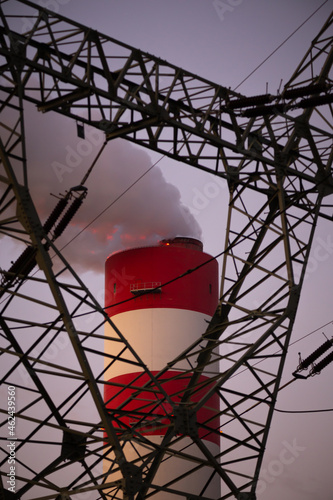 Close up for smoking chimney of the coal-fired power plant in Rybnik against the background of the evening sky. Photo taken during twilight under natural lighting conditions.