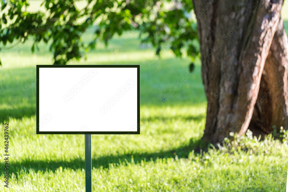 blank billboard on green grass