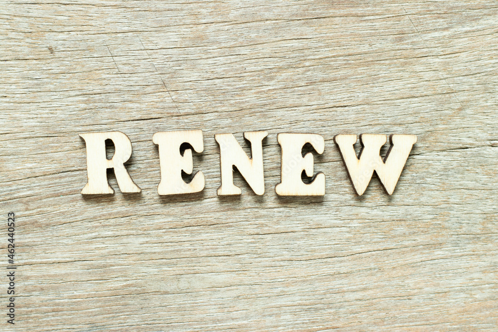 Alphabet letter in word renew on wood background Alphabet letter in word renew on wood background