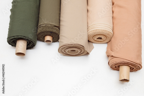 pastel color fabric rolls isolated on white, Synthetic and natural fabrics with copyspace.